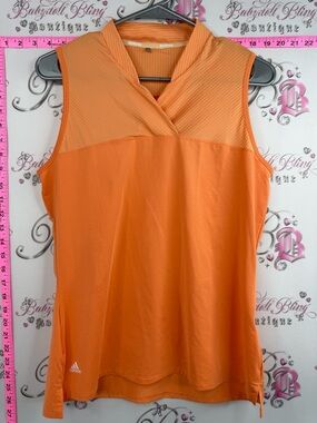 adidas Women's Sleeveless V-Neck Active Tank in a vibrant orange, activewear